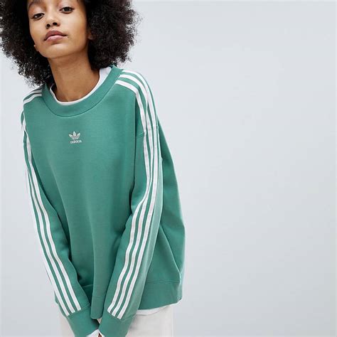 sudadera verde adidas originals simbolos al reves